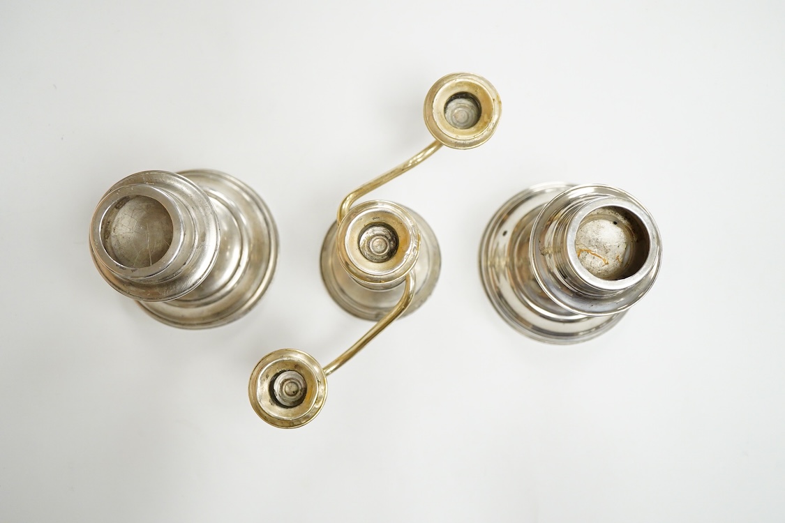A pair of continental 800 standard white metal candlesticks, 15.5cm, 11.5oz, together with a Frank M. Whiting & Company sterling two branch, three light dwarf candelabrum, 15cm, weighted.